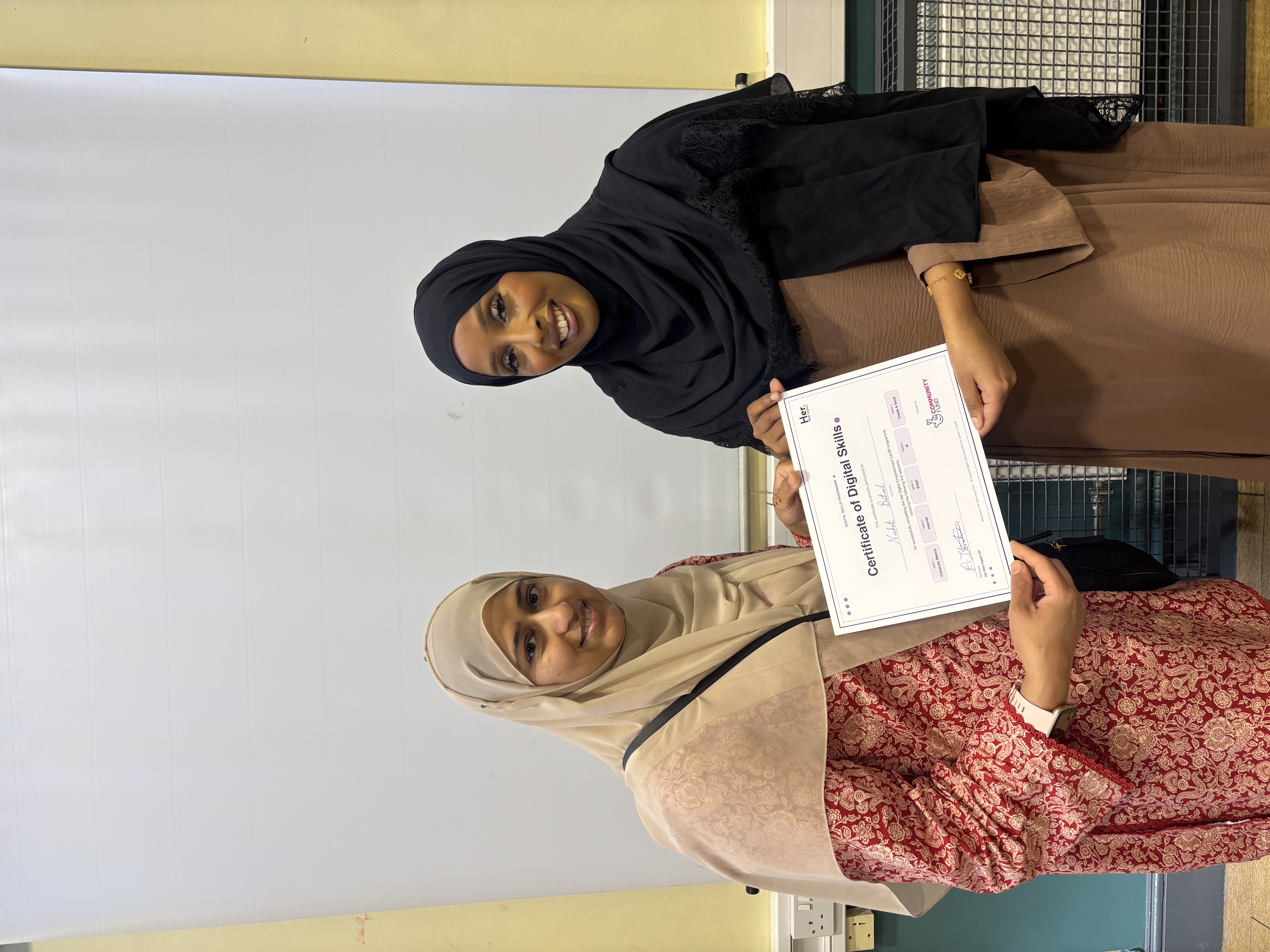 Participant receiving her digital skills certificate