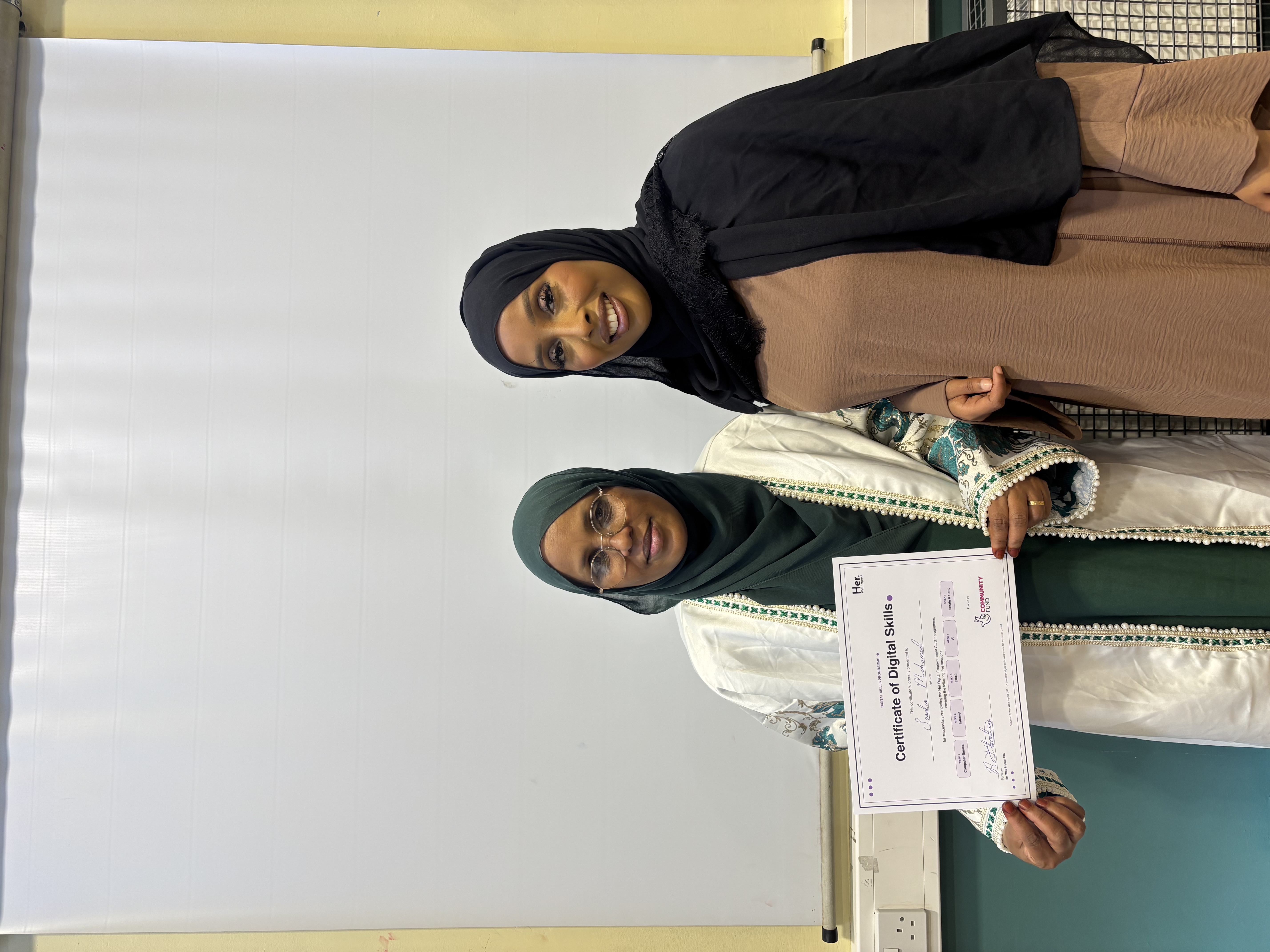 Participant receiving her digital skills certificate
