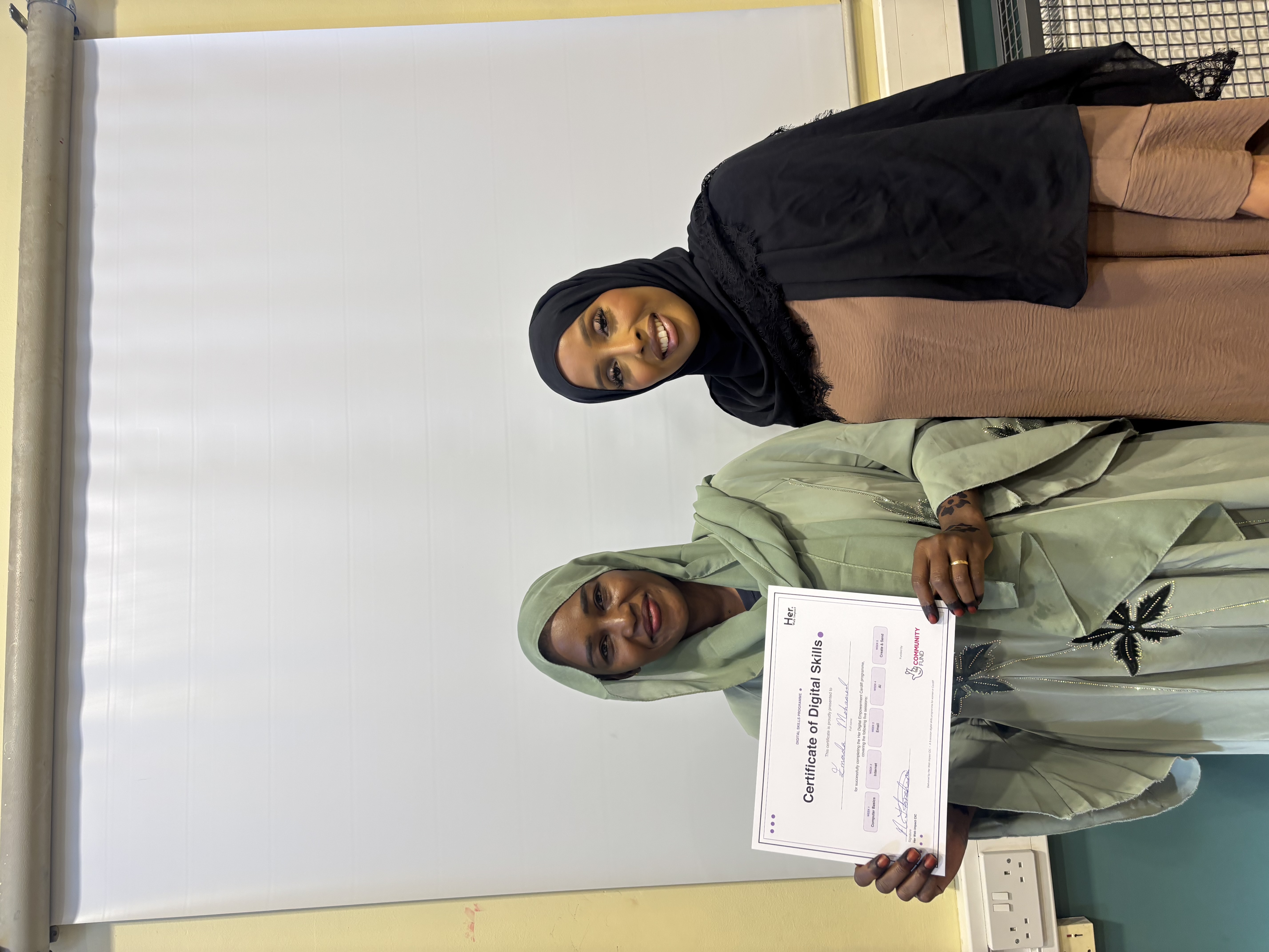 Participant receiving her digital skills certificate
